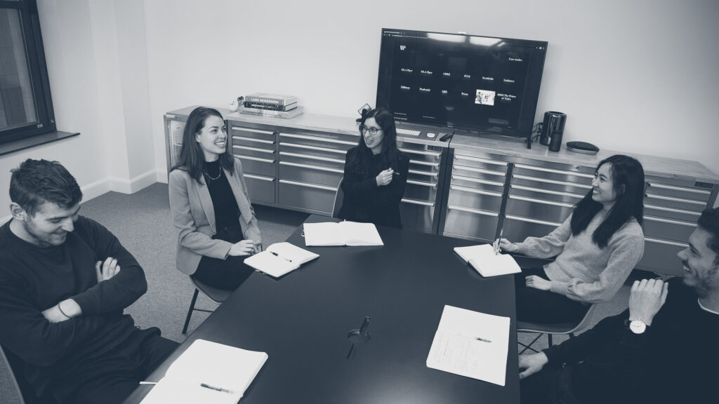 Within International's brand team having a meeting
