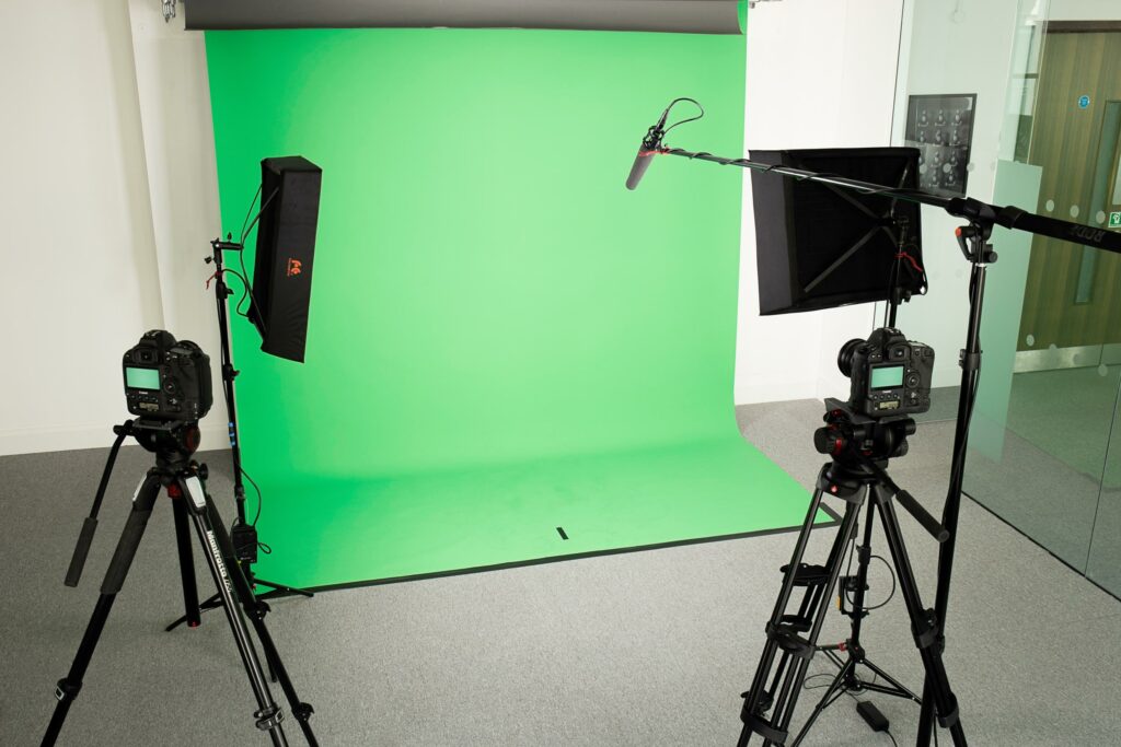 Photograph of a green screen filming studio.