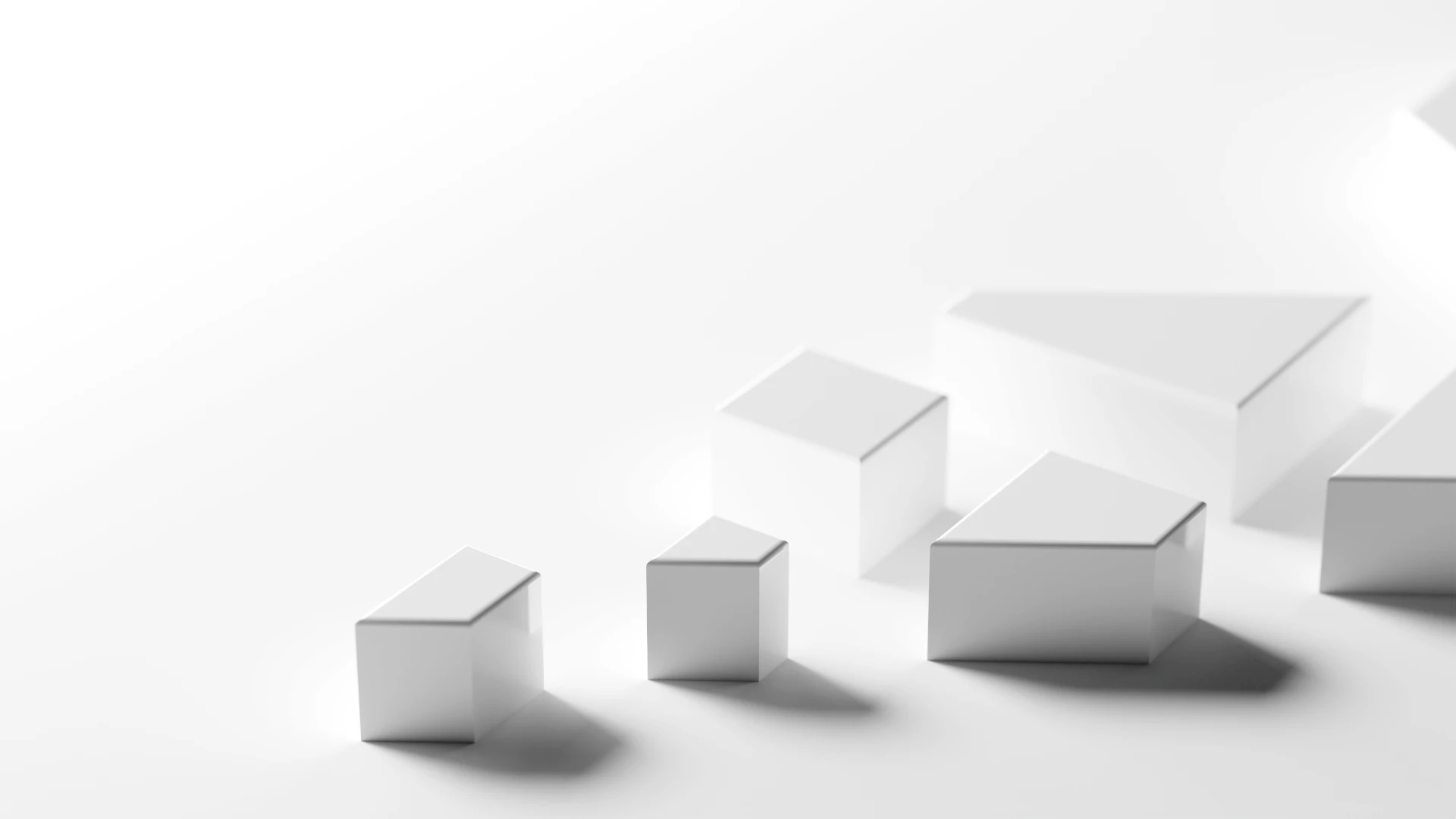 Abstract composition of white 3D cubes arranged in a row on a pale white background with soft shadows.
