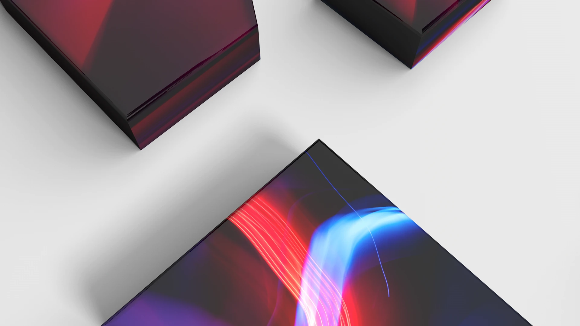 Abstract close-up of glossy, angled panels with red and blue neon reflections on a light gray background
