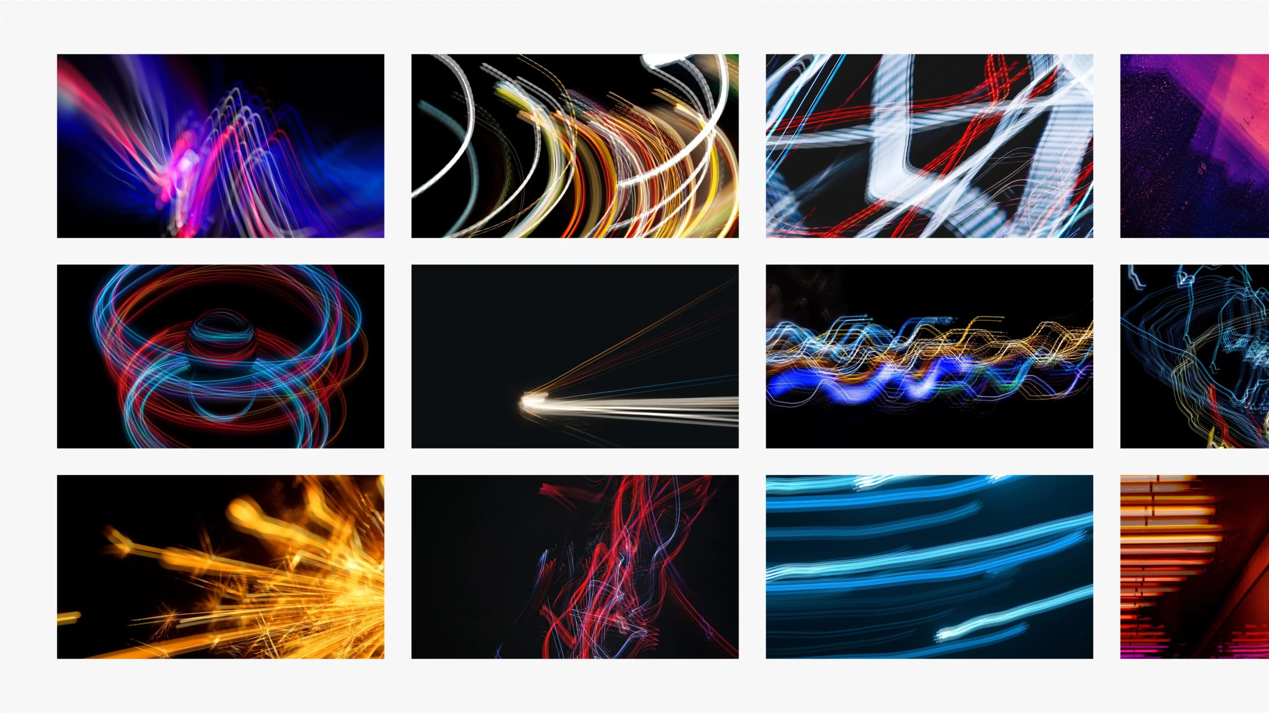Abstract 3D rendering of angled black panels with neon pink, blue, and purple light trails on a gray background to suggest motion.