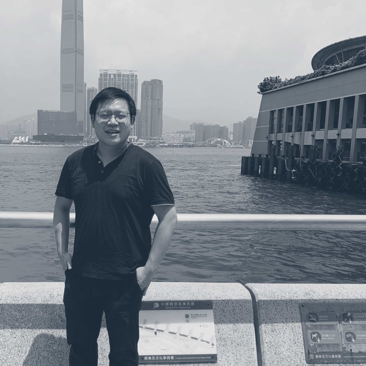 William Wong standing by Hong Kong harbour.